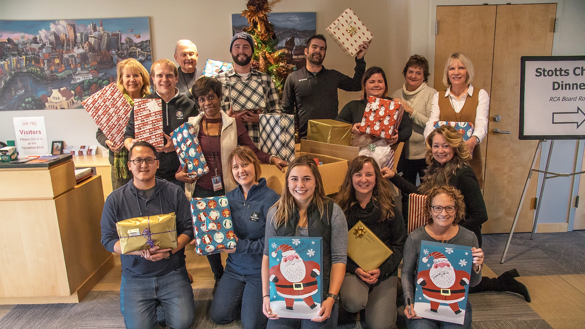 Visit Saint Paul Staff with Adopt-a-Family Donations for Face to Face